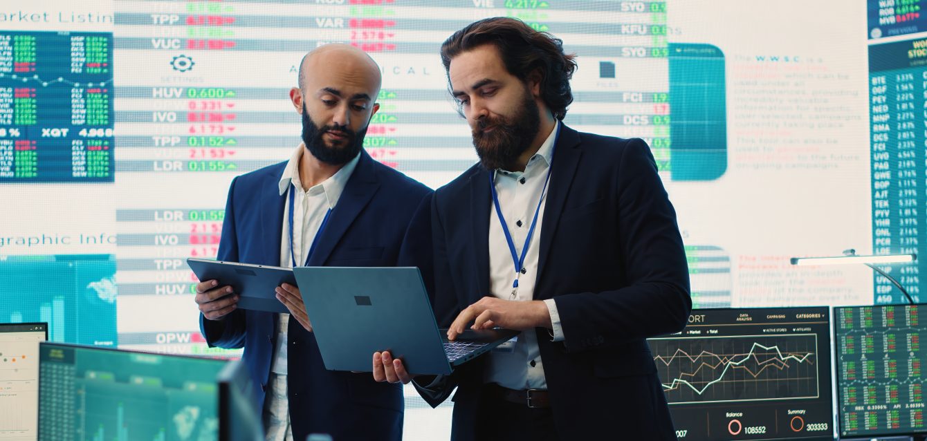 Team of investors analyzing profit amount and making decisions